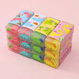 Dinosaur Eraser colorful dinosaur shaped erasers arranged in a stack