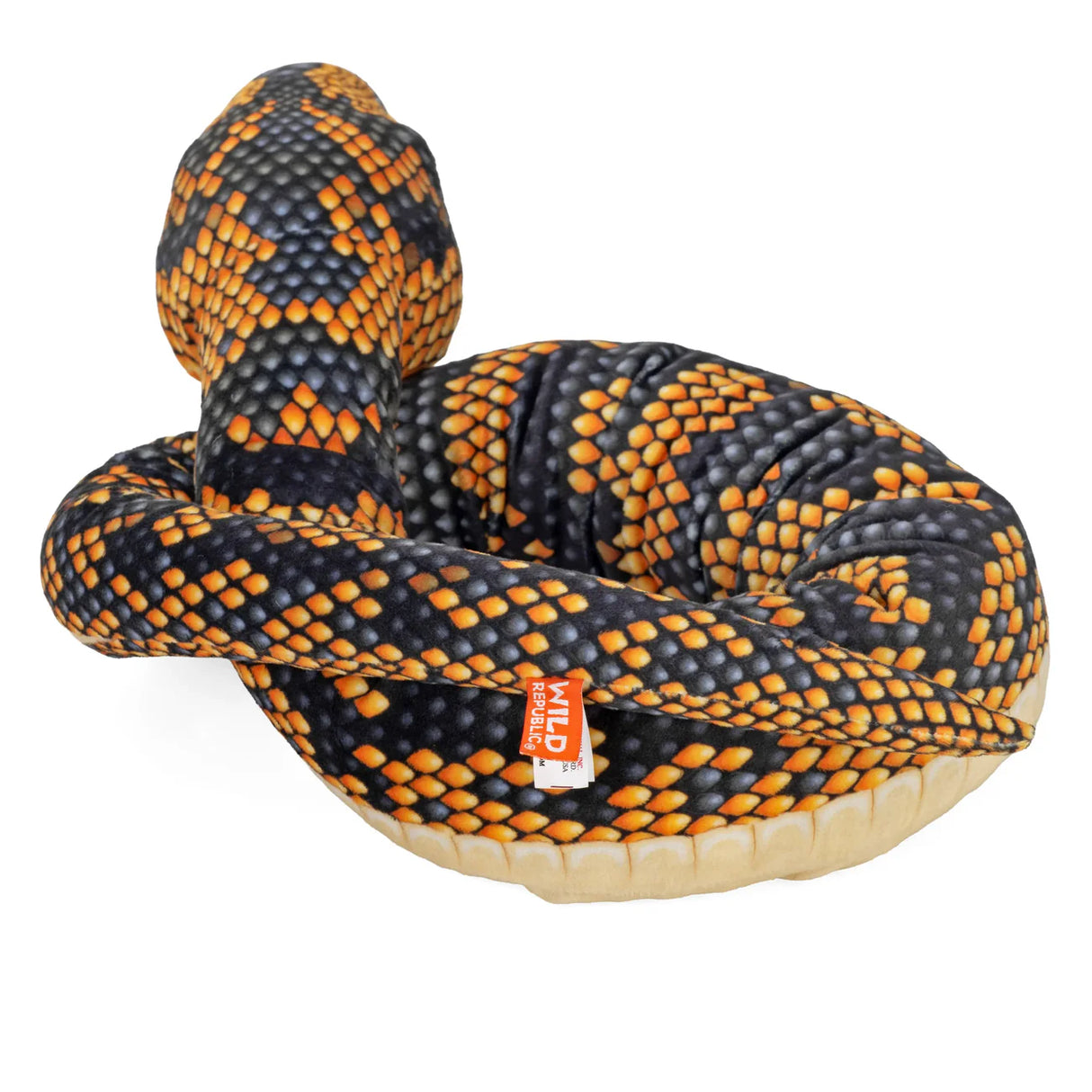 Soft snake plush toy with black and orange diamond scales curled up in resting position