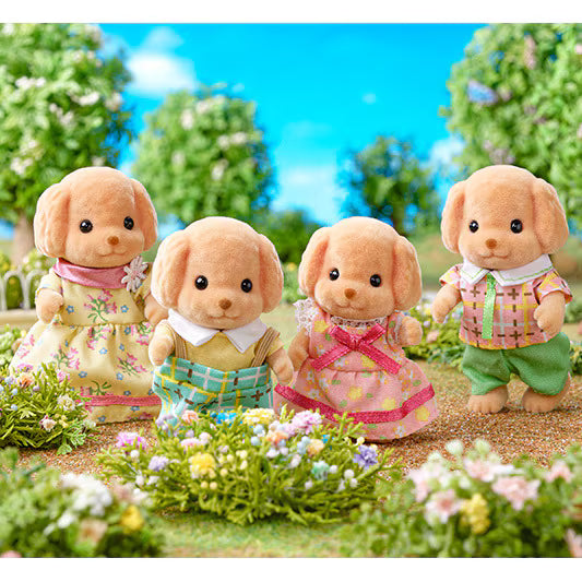 Toy Poodle Family plush figures in colorful outfits playing in a flower garden