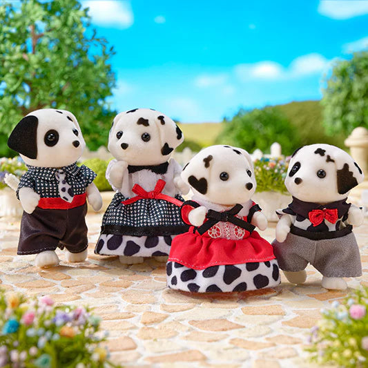 Dalmation Family plush dog family dressed in colorful outfits outdoors