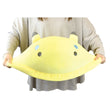 Person holding a soft, colorful, and cuddly yellow Jumbo Sea Slug plush pillow approximately 19 inches long.