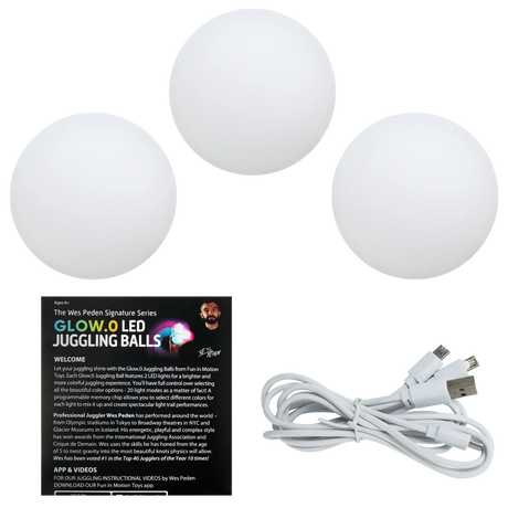 Glow.0 LED Juggling Balls by Wes Peden with three soft, squeezable balls and a triple head USB charging cable.