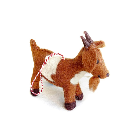 Handmade felt goat ornament in brown and white wool with red and white hanging string for holiday decor or gifting