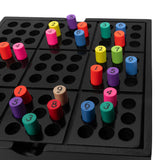 Sudoku puzzle board with colorful numbered pegs arranged across a black grid