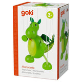 Green wooden dragon puppet with wings and round body hanging by white strings on white box packaging