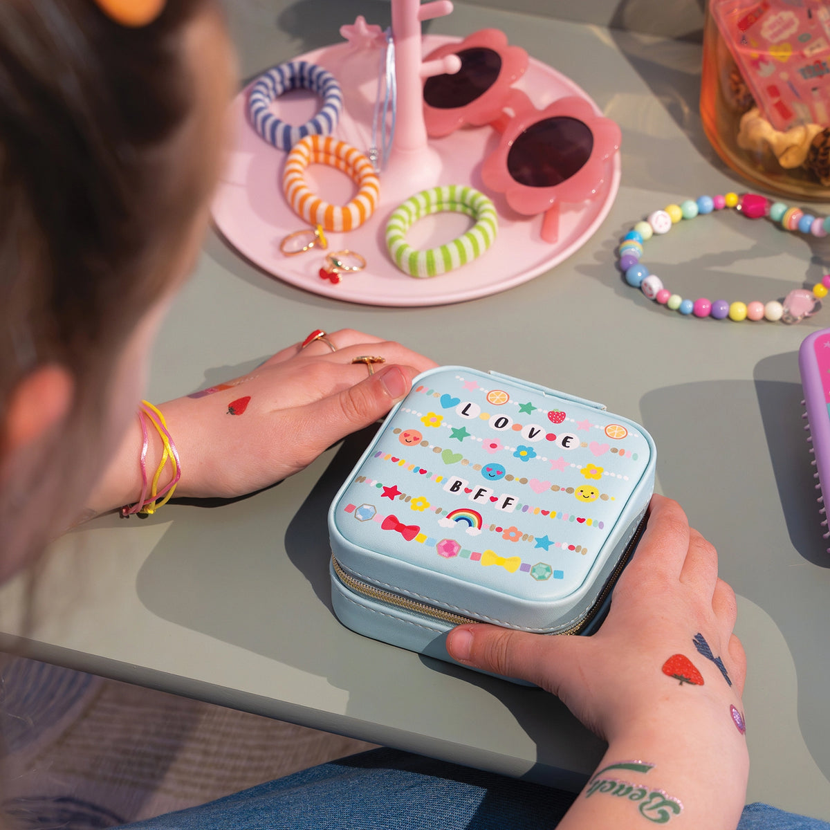 Fashion Friends Jewelry Case with colorful jewelry and bracelets on a table