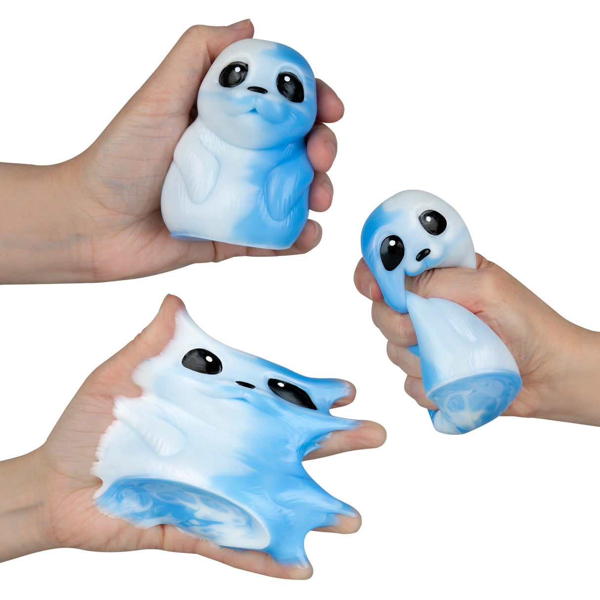 Hands holding and stretching a soft, blue and white squishy seal toy from the Taba-licious Pets collection