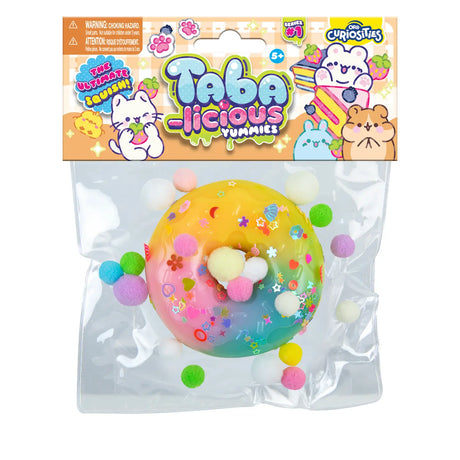 Taba-licious Mega Yummies Squishy colorful round pastry with pom-poms and star decorations in clear packaging