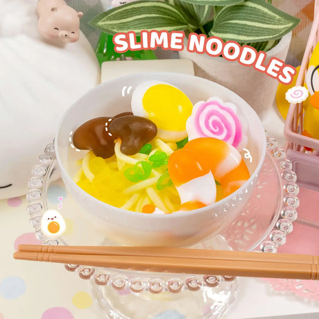 Instant Ramen Noodles Slime Kit showing a colorful bowl of slime noodles with toppings and chopsticks on a glass plate.