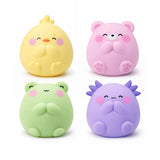 Four pastel animal figures in yellow pink green and purple with rosy cheeks and closed eyes