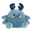 Soft blue plush beetle toy with smiling face and dark blue antennae sitting on a white background