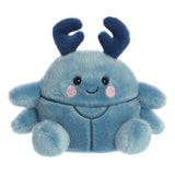 Soft blue plush beetle toy with smiling face and dark blue antennae sitting on a white background