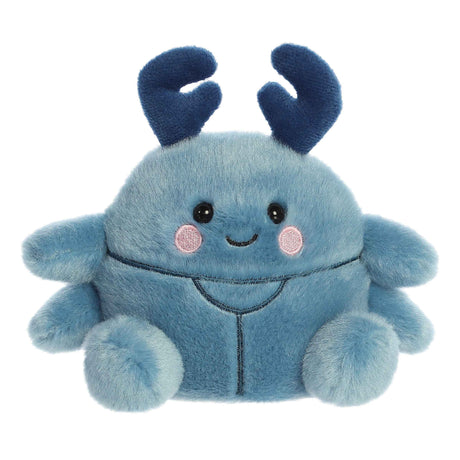 Soft blue plush beetle toy with smiling face and dark blue antennae sitting on a white background