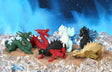 Assorted colorful Japanese puzzle eraser dragons hand-assembled and displayed on a textured surface with a blue background
