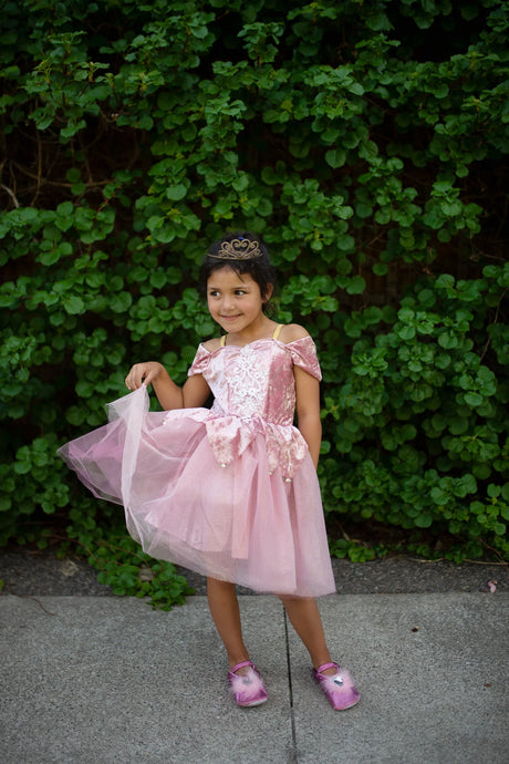 Young girl twirling in Prima Ballerina Dress Size 5-6 with dusty-rose velvet, lace, floral accents, and tulle skirt.