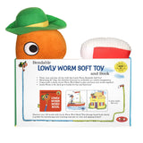Lowly Worm bendable soft toy in green hat holding a board book with colorful illustrations for children ages 3 and up
