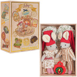 Two soft fabric mice in cozy pajamas with red hats inside a decorated gift box with travel-themed designs