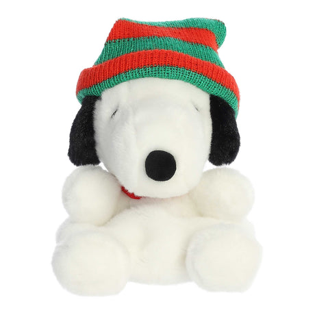 Soft plush Snoopy wearing a red and green striped knitted beanie, perfect for cozy winter fun