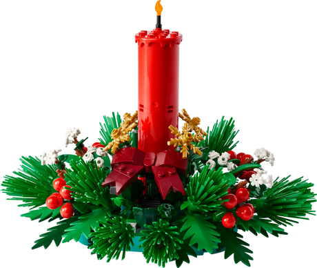 Red candle centerpiece with green foliage, red berries, golden stars, and white floral accents holiday decor.