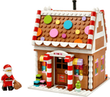 Seasons and Occasions Festive Gingerbread House with colorful candy decorations and Santa figure