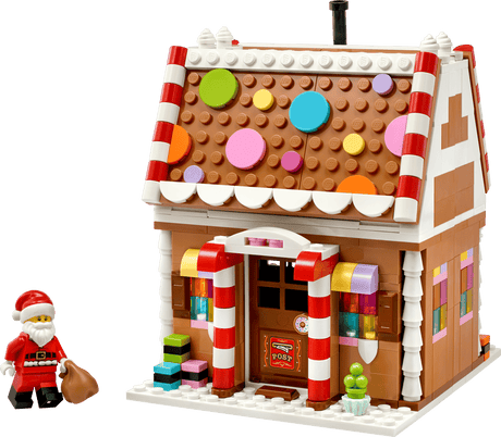 Seasons and Occasions Festive Gingerbread House with colorful candy decorations and Santa figure