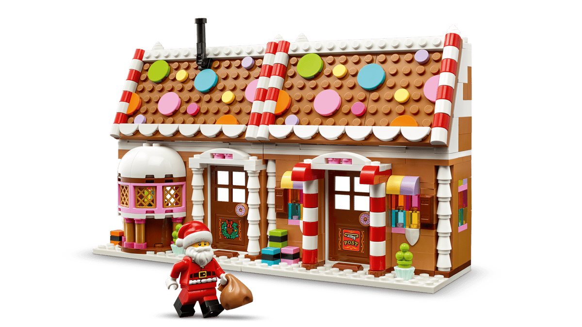 Seasons and Occasions Festive Gingerbread House with colorful candy details and Santa figure