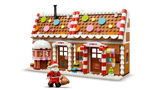 Seasons and Occasions Festive Gingerbread House with colorful candy details and Santa figure