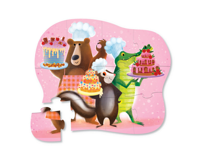 12pc Sweet Treats Puzzle features a bear, skunk, and crocodile baking colorful cakes on a pink background.