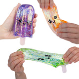 Sugar Swaps Ice Pop glittery ice pop squishy toys in purple orange and green being stretched by hands