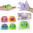Taba-Licious Couch Potato colorful couch-shaped squishy toys shown packaged and stretched by hand