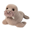 Soft plush walrus toy with light brown fur, dark eyes, and white tusks on white background