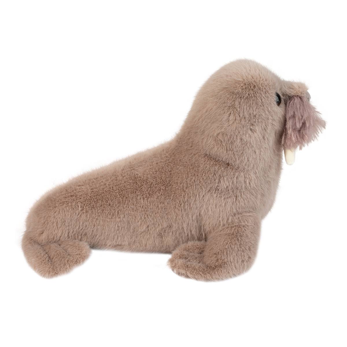 Soft plush toy resembling a walrus with light brown fur, small tusks, and whiskers on white background