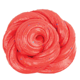 Bright red twisted slime with scattered multicolored glitter flakes on a white background