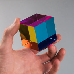 CMY Cubes | The Original Cube colorful geometric puzzle cube held in one hand