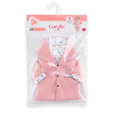 Pink doll raincoat with hood and colorful animal-themed lining in clear plastic packaging
