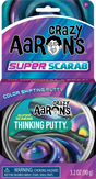 Color shifting putty with swirling metallic hues of purple, blue, green, and gold in round packaging and colorful branded box design