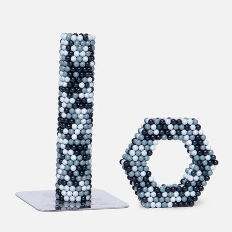 Speks. Pixel. Game Over. magnetic balls shaped into a tower and a hexagonal ring for creative play.