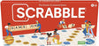 Scrabble classic crossword board game box with wooden letter tiles and players around a colorful game board
