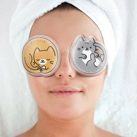 Woman relaxing with Chill Out! Eye Pads Kittens gel eye pads on closed eyelids for self-care.