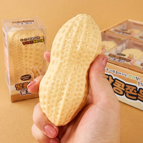 Peanut Mochi Squishy held in a hand with a realistic textured peanut design