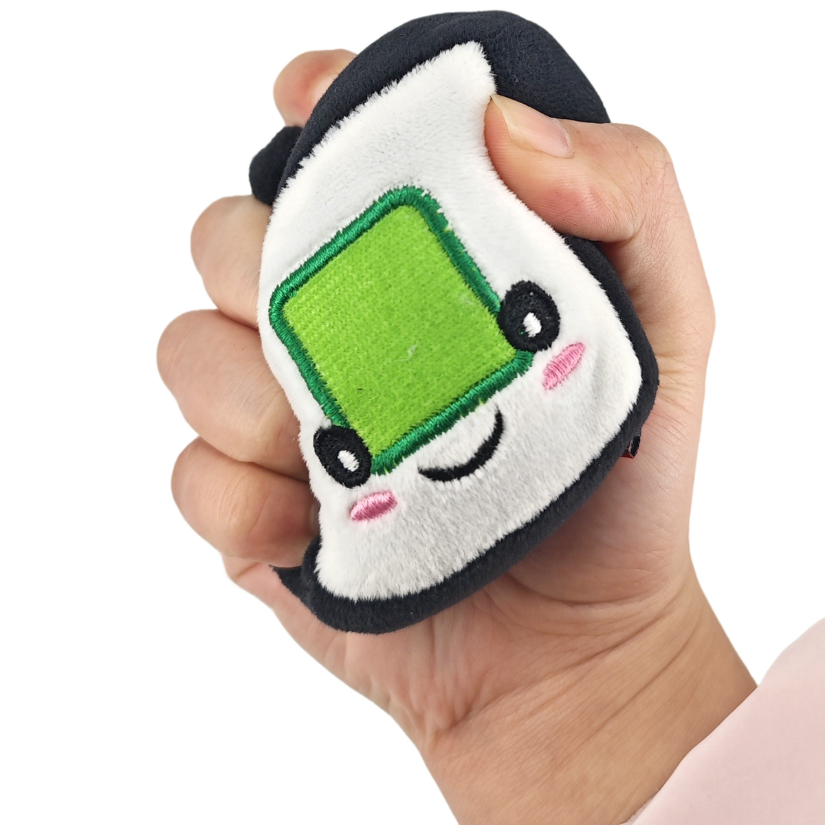 Knead That Sushi plush toy being squeezed in a hand