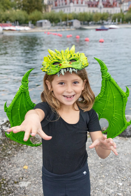 Dragon Mask | Green worn by child with wings outdoors near water, featuring vibrant green rubberized dragon design.