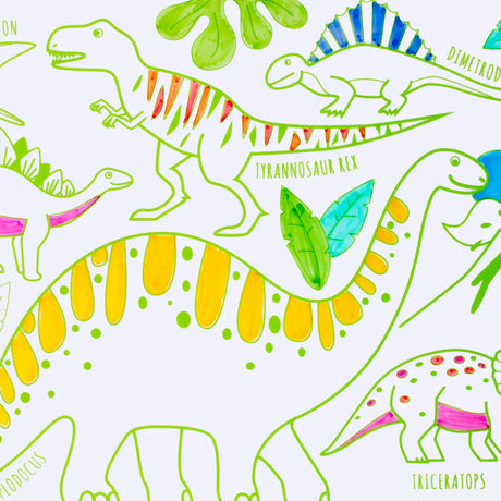Mini Play Mat Dino reversible silicone drawing mat with colorful dinosaur illustrations and four markers for kids ages 3 and up.