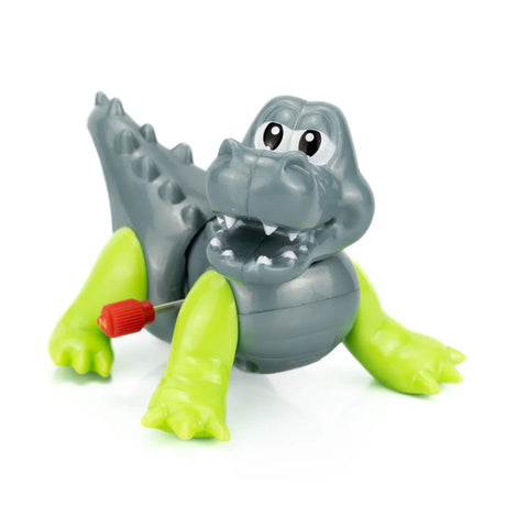 Cute gray and green wind-up toy alligator with a red key, smiling and ready to walk across the floor