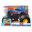 Hot Wheels monster truck styled with Superman theme, oversized wheels, and bright blue and red colors in clear packaging