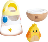 Colorful wooden wobble stacker toy with yellow chick figure and wooden base for toddler play and coordination skills development