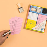 Kids Library Kit with checkout cards, date stamp, and pencil for fun book lending and sharing at home.