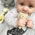 Organic Rubber Teether Rattle | Lion held by baby, made of natural latex, easy to grip, gentle sound, non-toxic and BPA free.