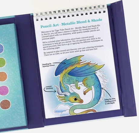 Pencil Art set open showing a metallic blend and shade technique page with a colorful dragon illustration.