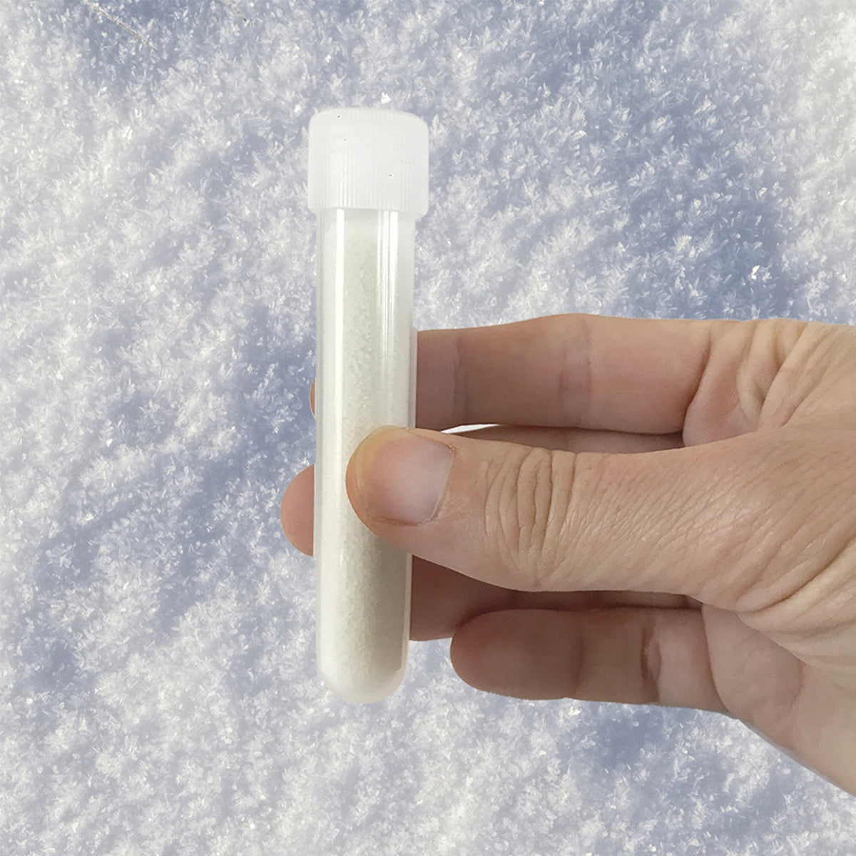 Instant Blizzard: Instant Snow Kit test tube held over fluffy artificial snow